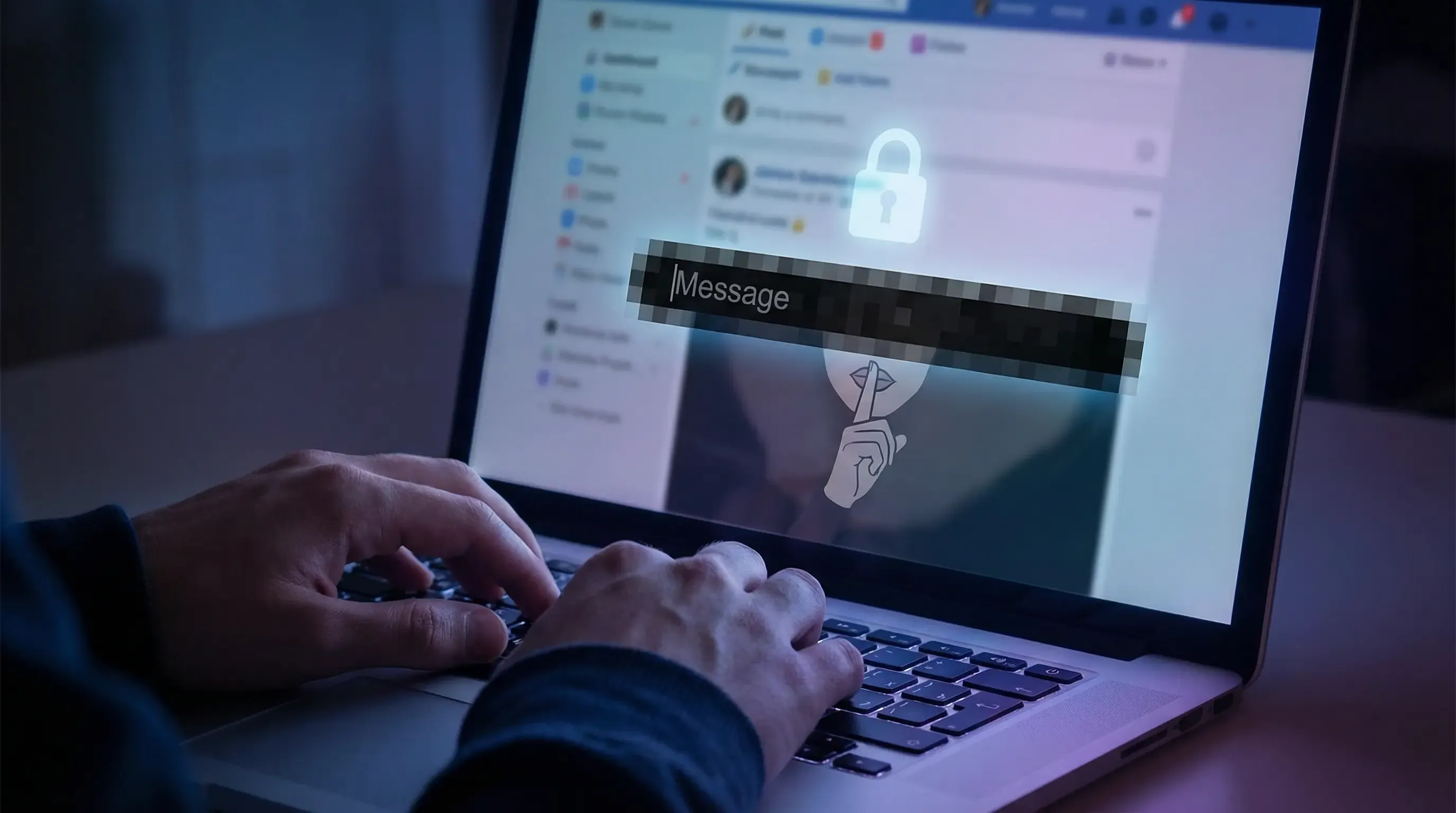 An image of a person typing in a message on their laptop